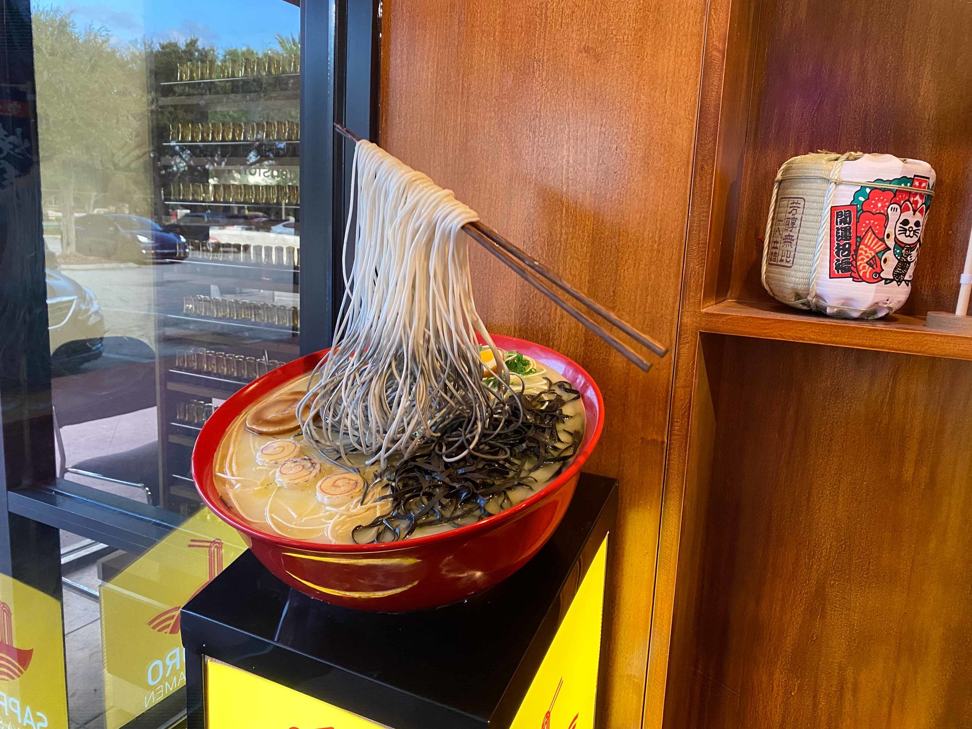 fake noodle bowl with floating chopsticks